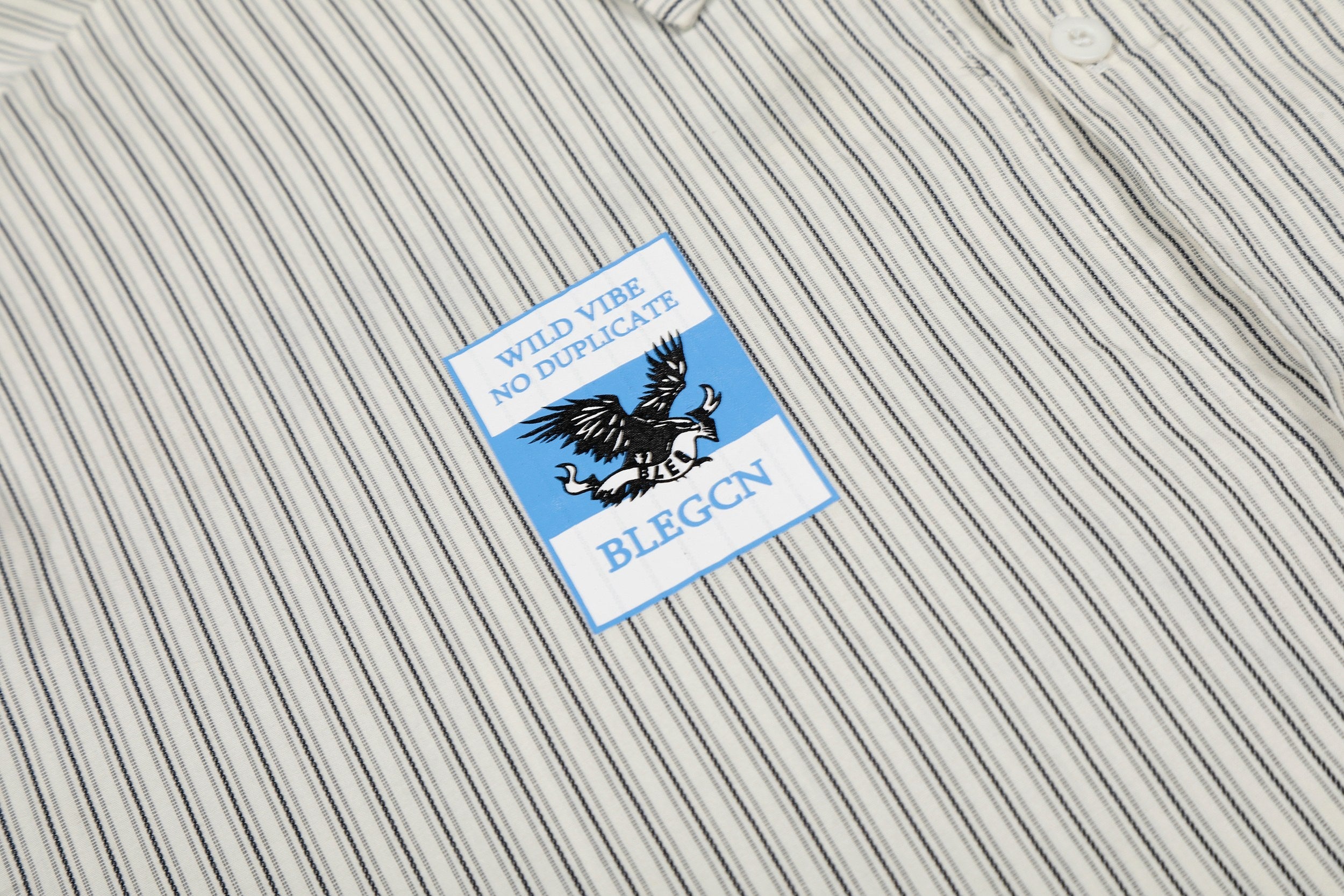 Omirad “Pinstripe Patch Graphic Shirt”