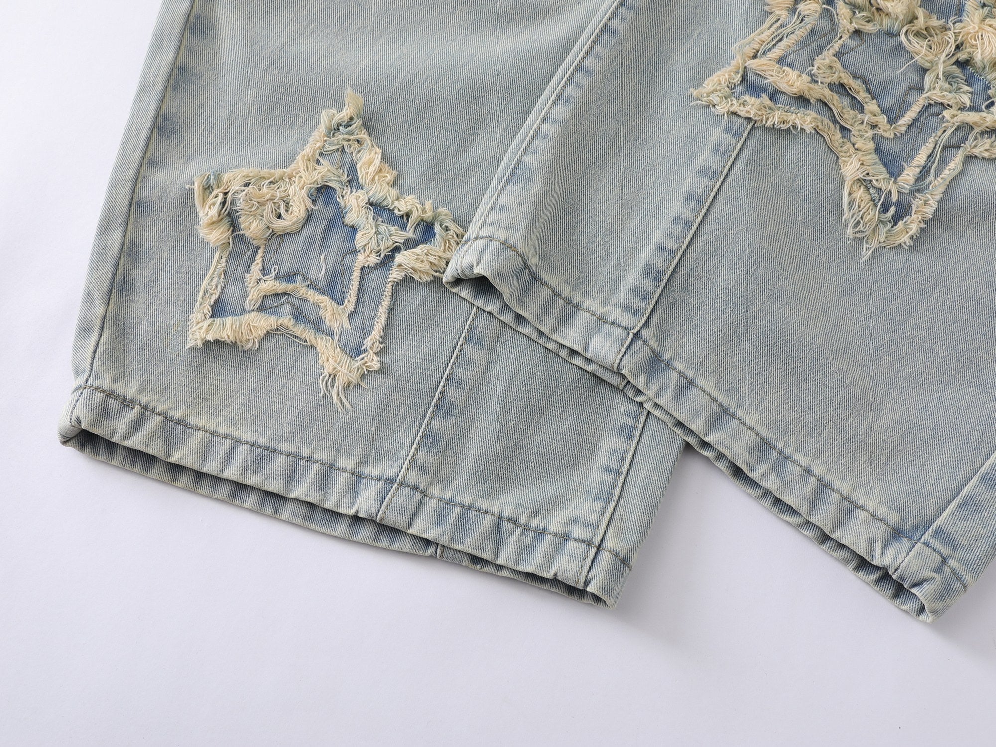 Omirad “Star Distressed Wide-Leg Jeans”