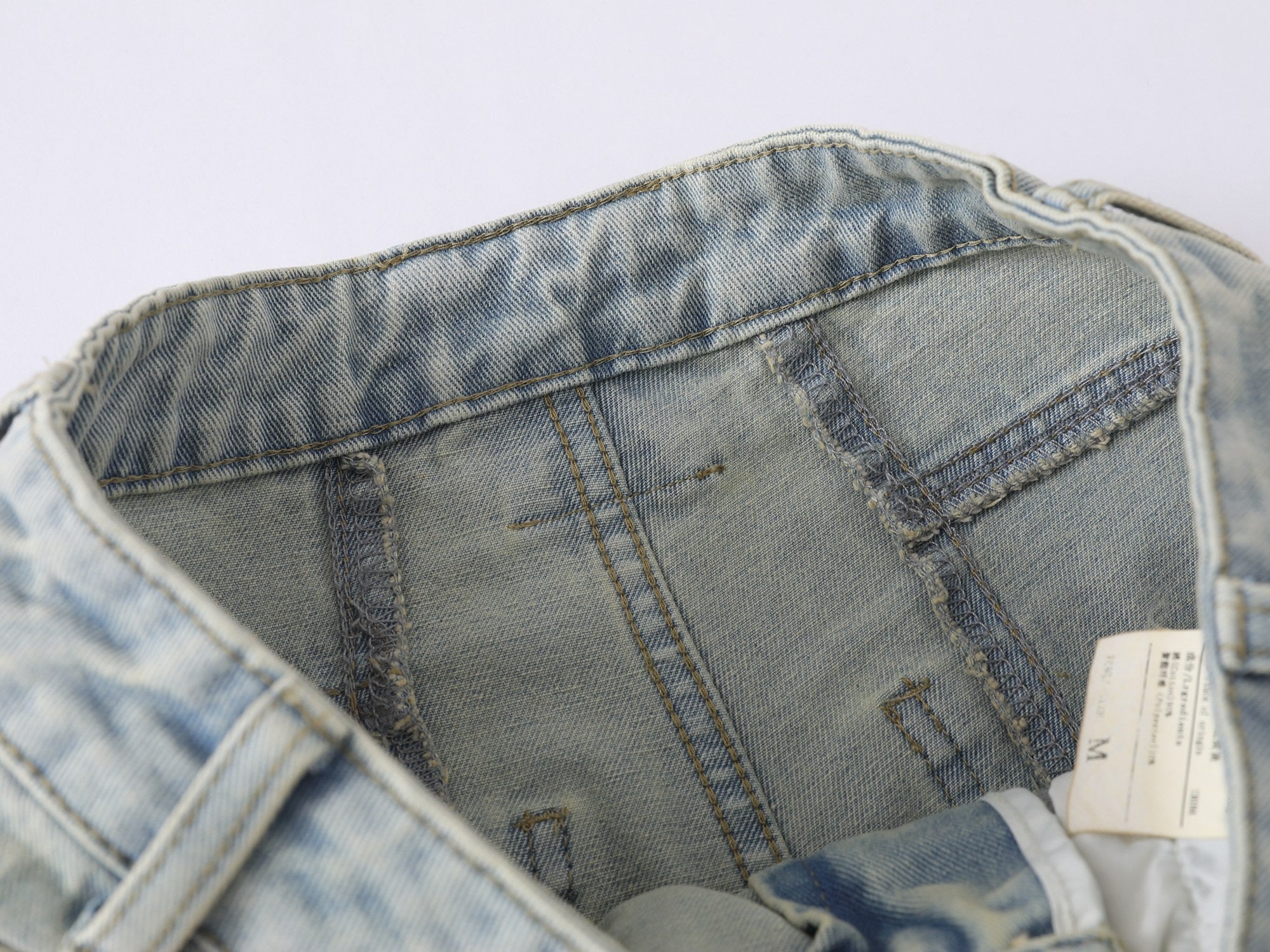 Omirad “Star Distressed Wide-Leg Jeans”