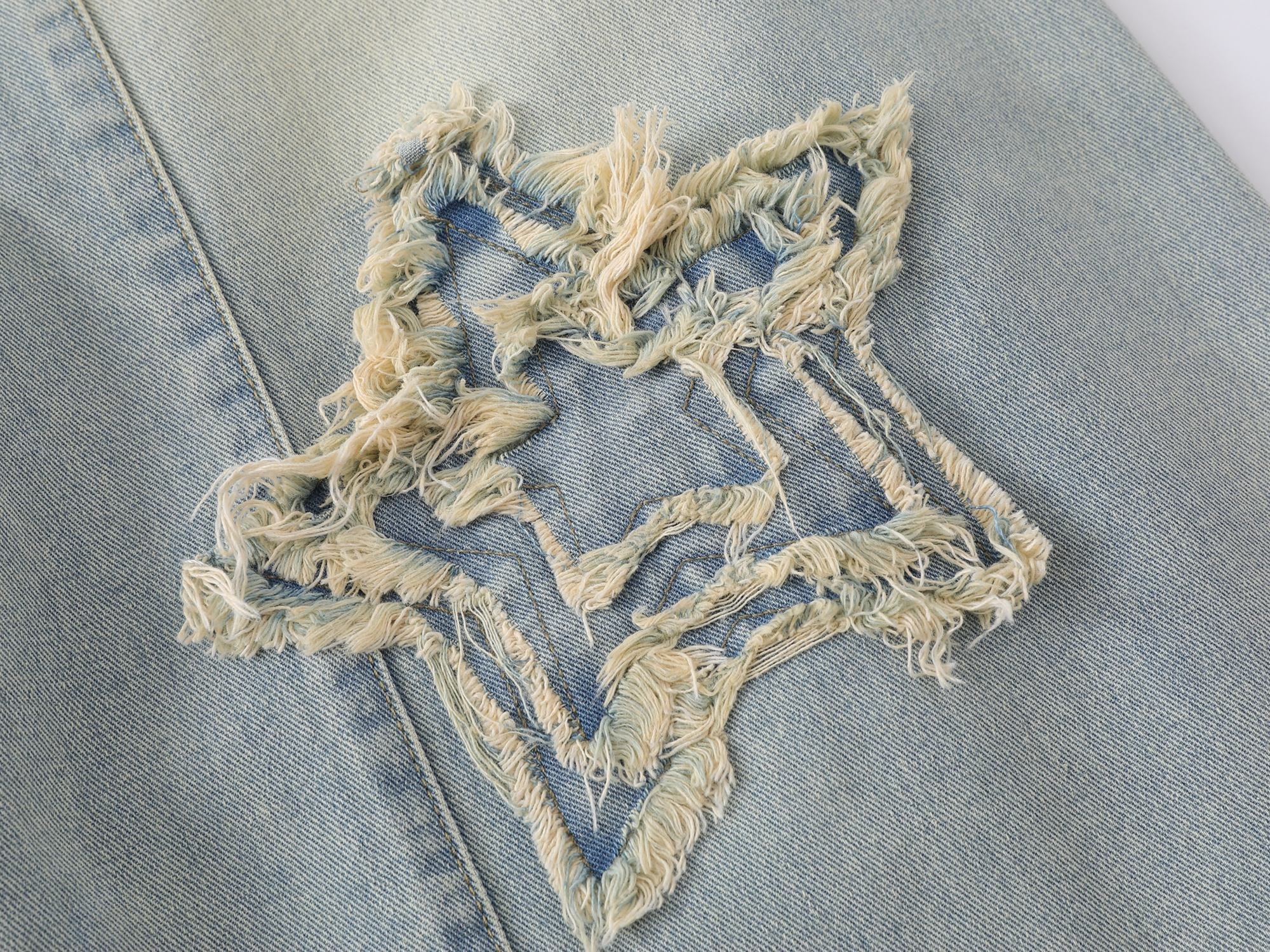 Omirad “Star Distressed Wide-Leg Jeans”
